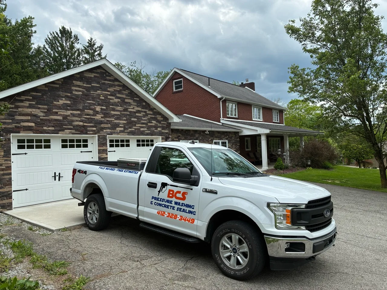BCS Pressure Washing and Concrete Sealing branded work truck