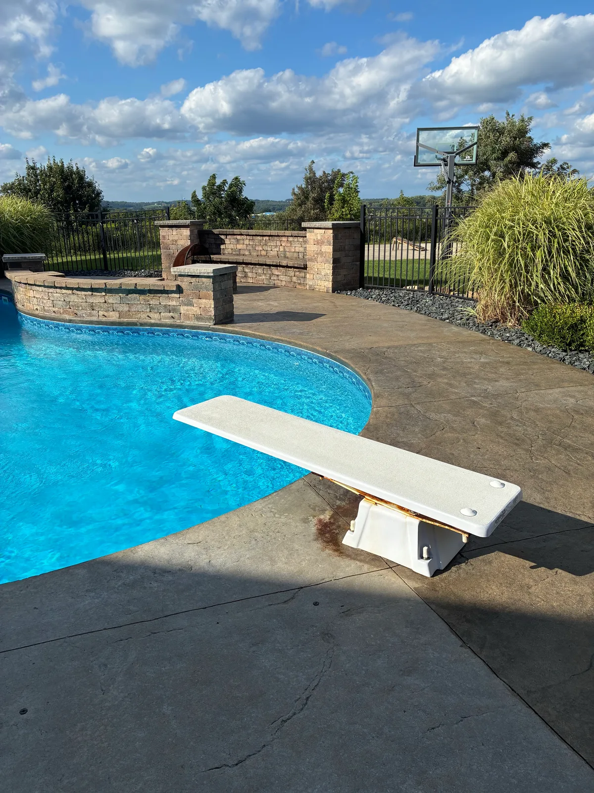 Clean concrete surrounding a finished swimming pool area